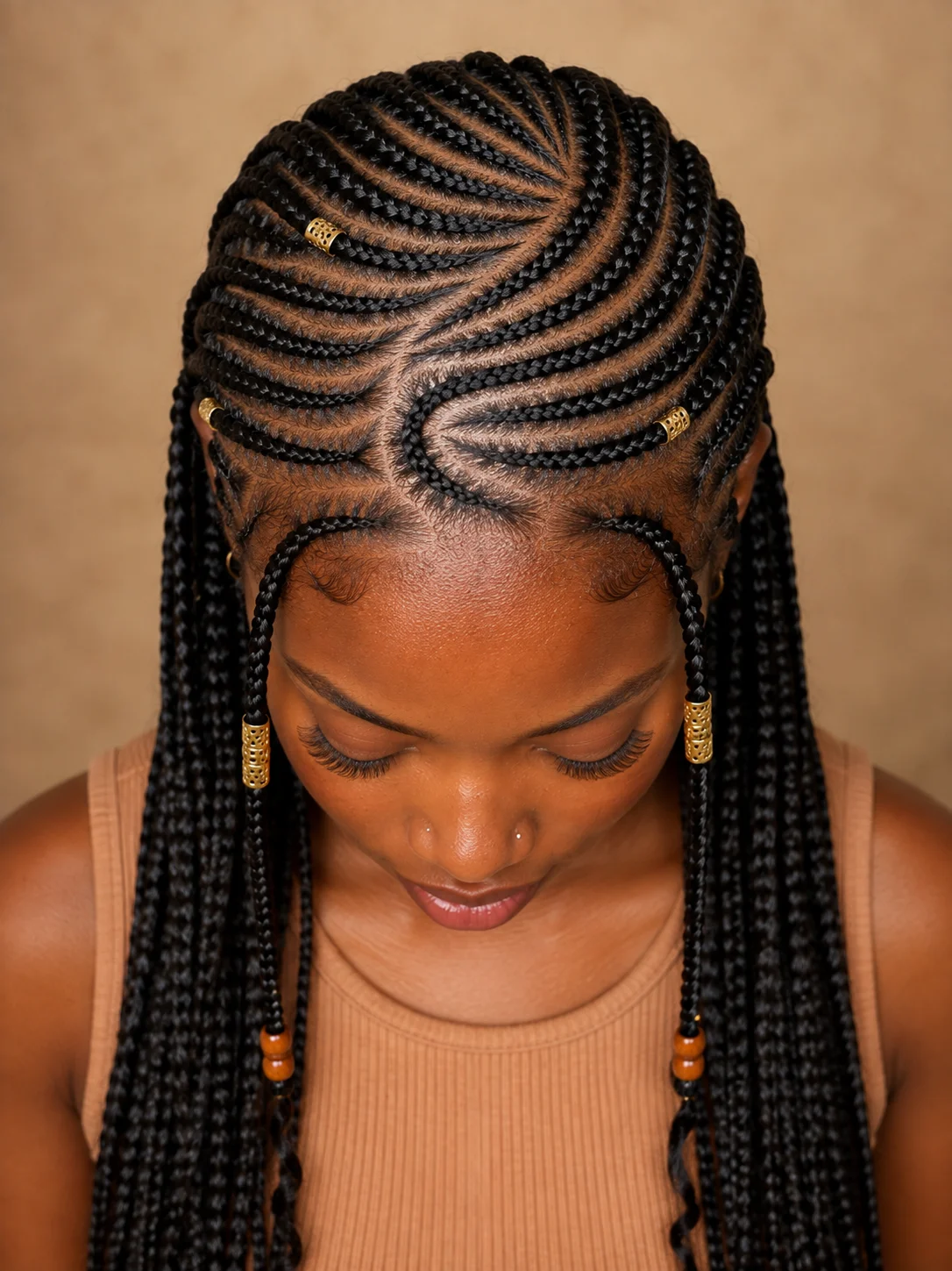 Curved swirl-pattern Fulani braids with S-shaped cornrows