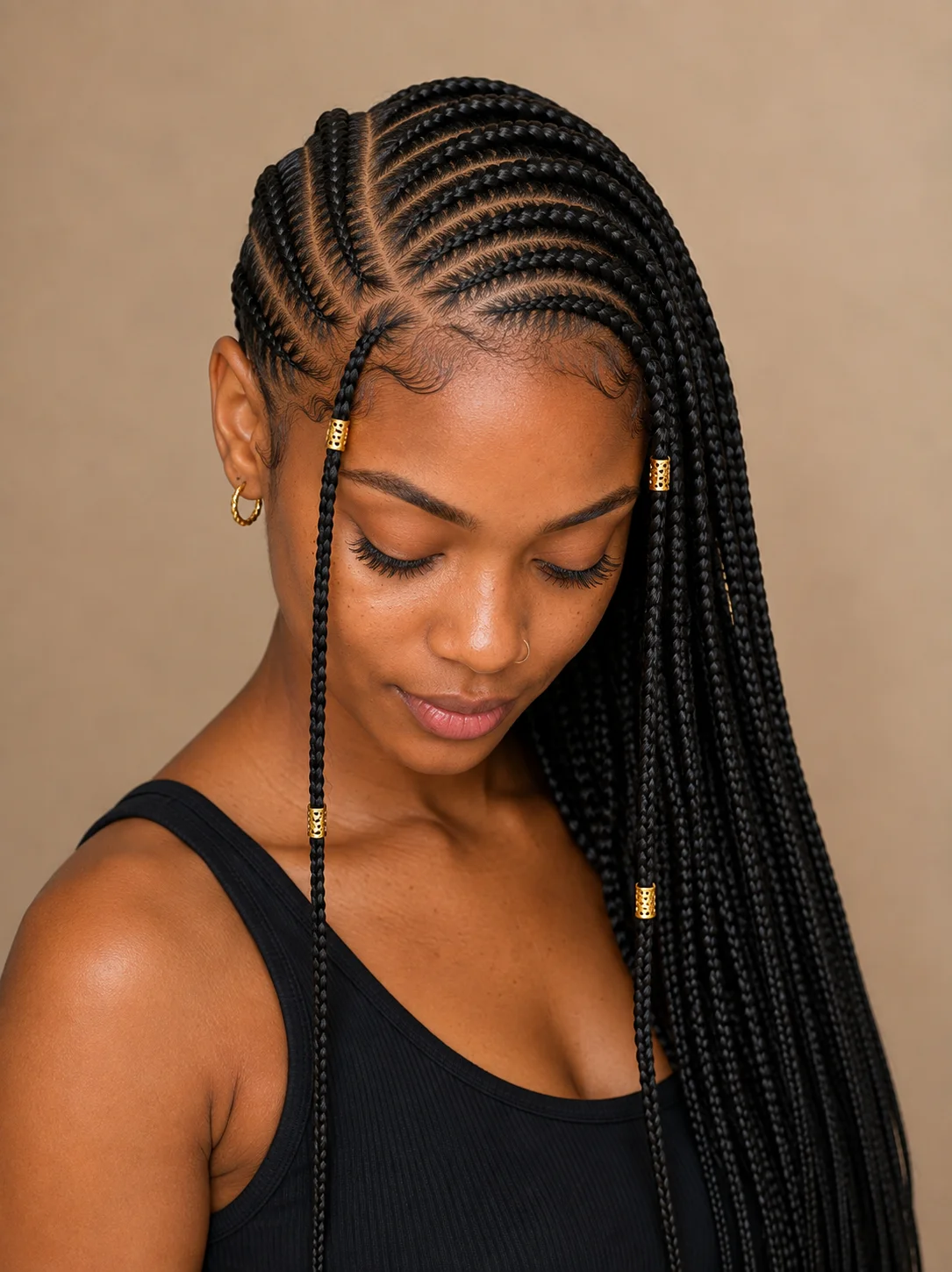 Hybrid Fulani lemonade braids showing Fulani-style face-framing pattern up front transitioning into a directional lemonade sweep